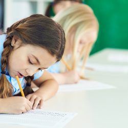 School girl taking test