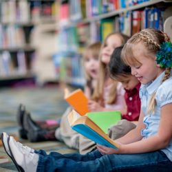 Primary school child reading for World Book Day in Northern Ireland